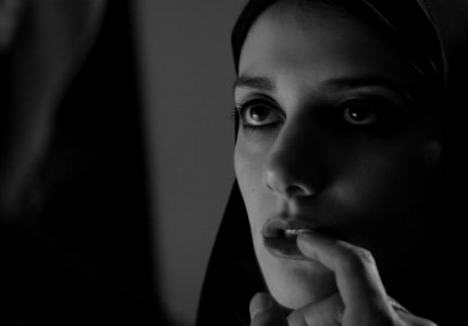 A girl walks home alone at night